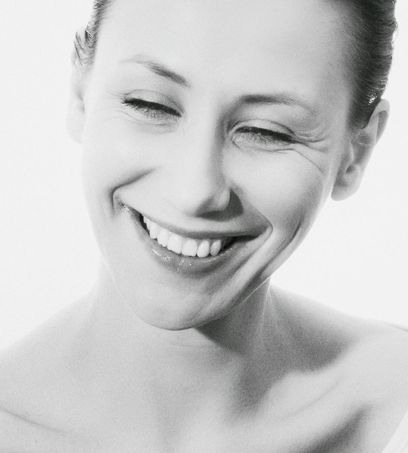 a woman smiling for the camera
