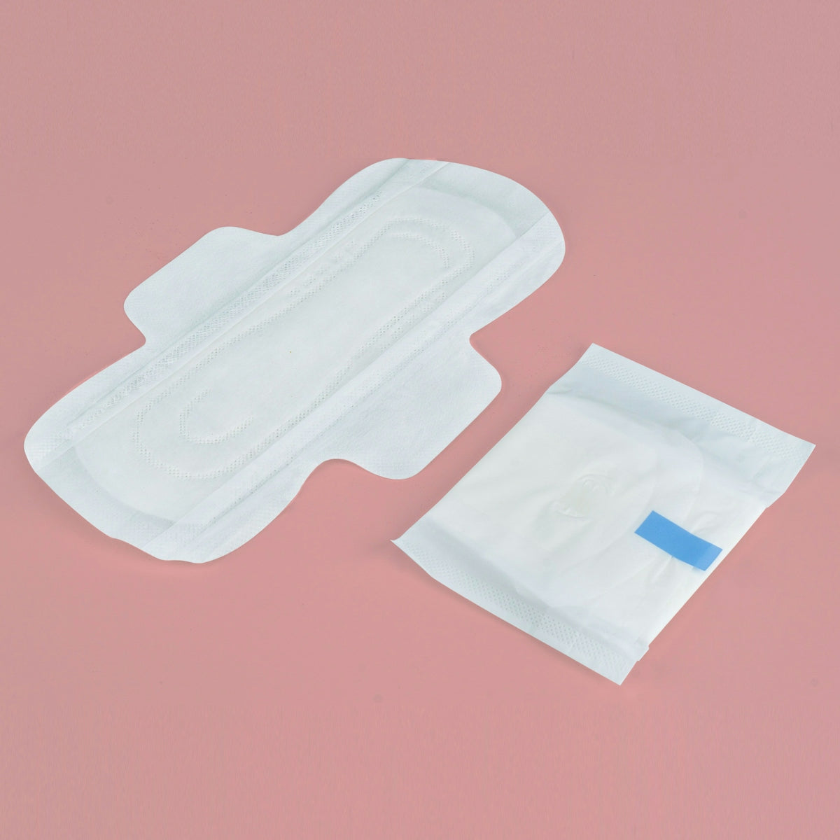 Two sanitary pads on a pink background